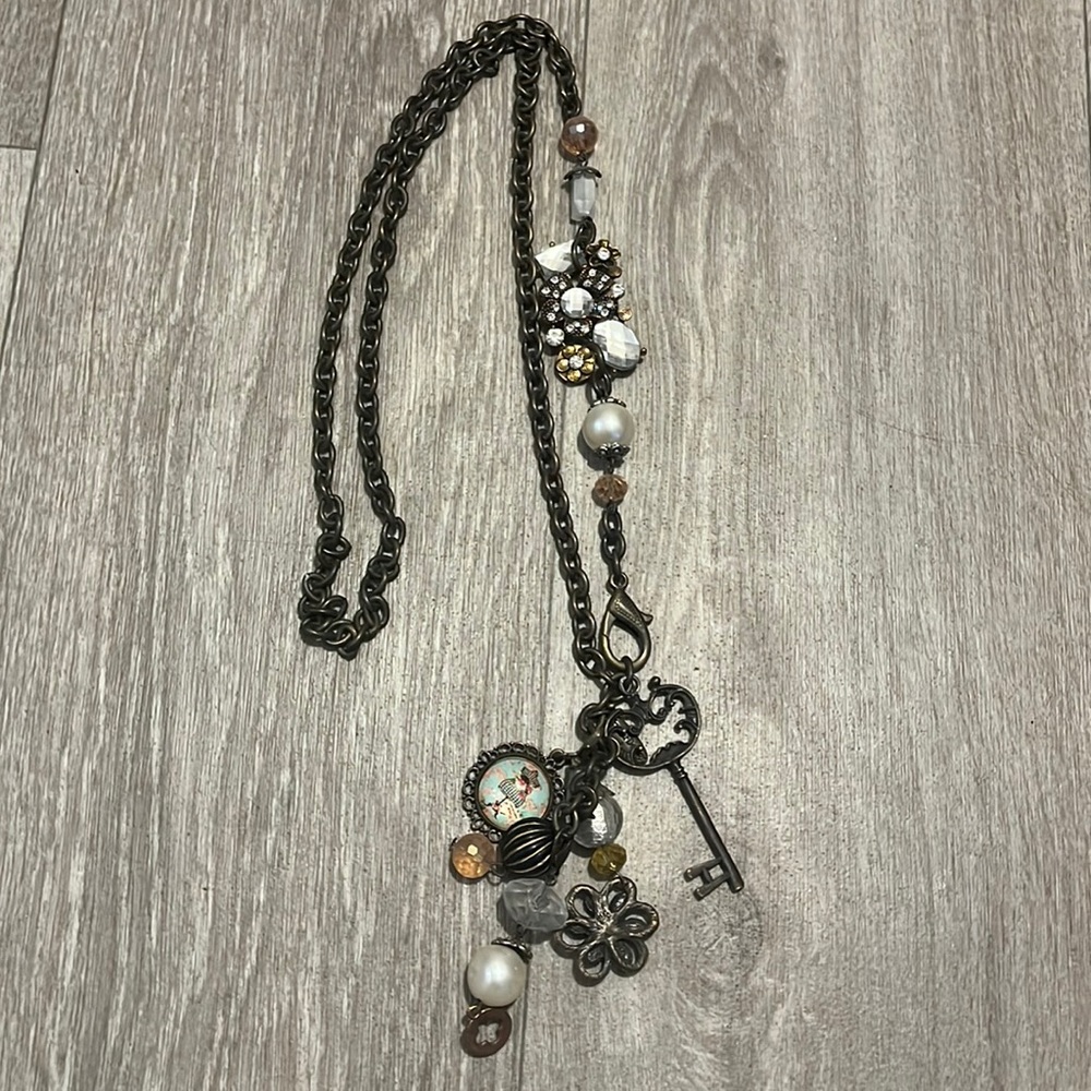 Plunder long charm necklace.